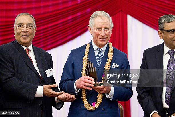 Prince Charles, Prince Of Wales is presented with the Ahimsa Award which recognises individuals who show compassion and tolerance to humanity,...