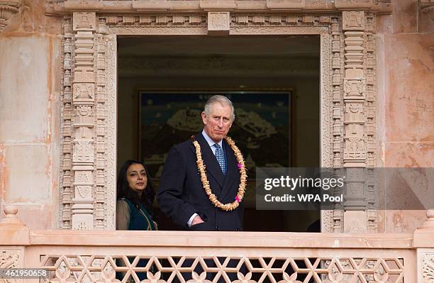 Prince Charles, Prince Of Wales looks out at the gardens during a tour of the Jain Temple on January 22, 2015 in Potters Bar, Hertfordshire, England....