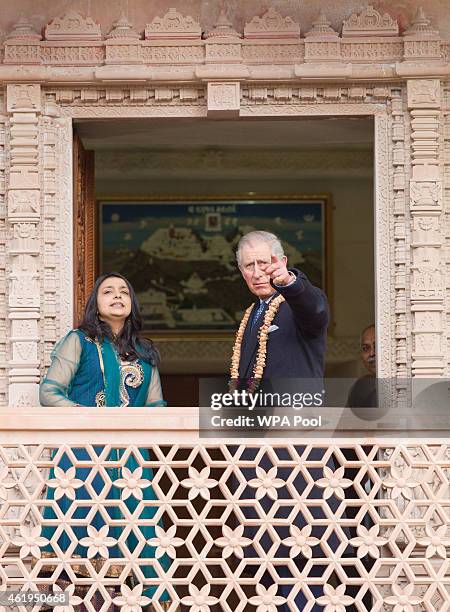 Prince Charles, Prince Of Wales looks out at the gardens with Arshana Sanghrajka an expert in Jain Temple Architecture during a tour of the Jain...