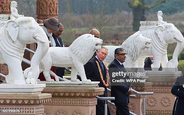 Prince Charles, Prince Of Wales walks in the gardens during a tour of the Jain Temple on January 22, 2015 in Potters Bar, Hertfordshire, England. The...