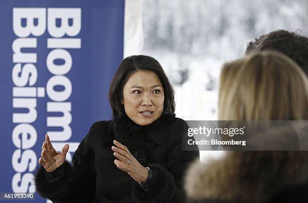 Zhang Xin, billionaire and chief executive officer of Soho China Ltd., left, gestures as she speaks during a Bloomberg Television on day two...