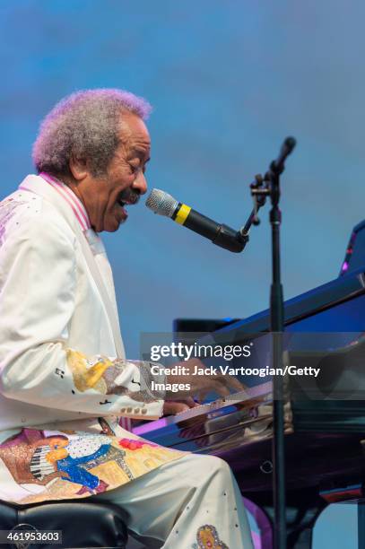 American R&B and Blues composer, musician, arranger and record producer Allen Toussaint sings and plays piano during a solo set at the 30th Annual...