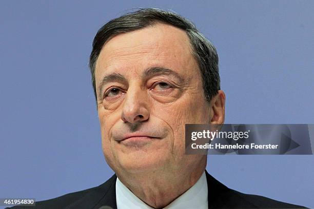 Mario Draghi, head of the European Central Bank , arrives to speak to journalists following a meeting of the ECB governing board on January 22, 2015...
