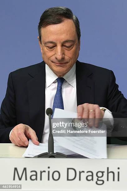 Mario Draghi, head of the European Central Bank , arrives to speak to journalists following a meeting of the ECB governing board on January 22, 2015...