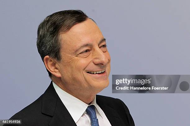 Mario Draghi, head of the European Central Bank , arrives to speak to journalists following a meeting of the ECB governing board on January 22, 2015...