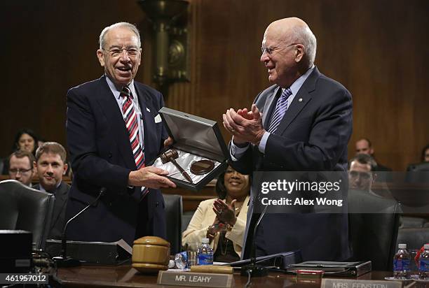 Sen. Chuck Grassley is presented with a custom made gavel by Sen. Patrick Leahy during an executive business meeting of the Senate Judiciary...