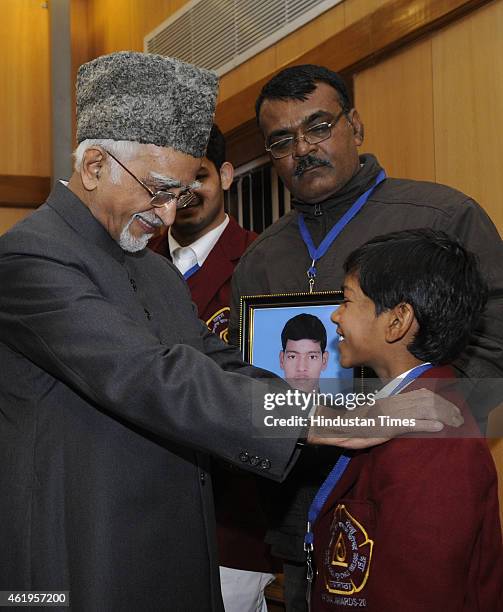 The Vice President Hamid Ansari meets the "National Bravery Award 2015" winning children, at his residence on January 22, 2015 in New Delhi, India....