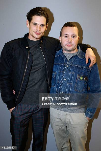 Fashion designer Kim Jones and Actor Jeremie Laheurte pose backstage after the Louis Vuitton Menswear Fall/Winter 2015-2016 Show as part of Paris...
