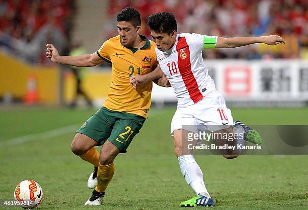 Massimo Luongo of Australia and Zheng Zhi of China challenge for the ball during the 2015 Asian Cup match between China PR and the Australian...