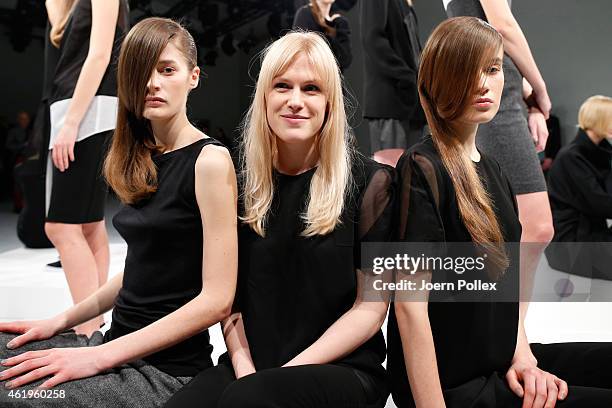 Designer Margit Peura poses with models at the Whitetail show during the Mercedes-Benz Fashion Week Berlin Autumn/Winter 2015/16 at Brandenburg Gate...