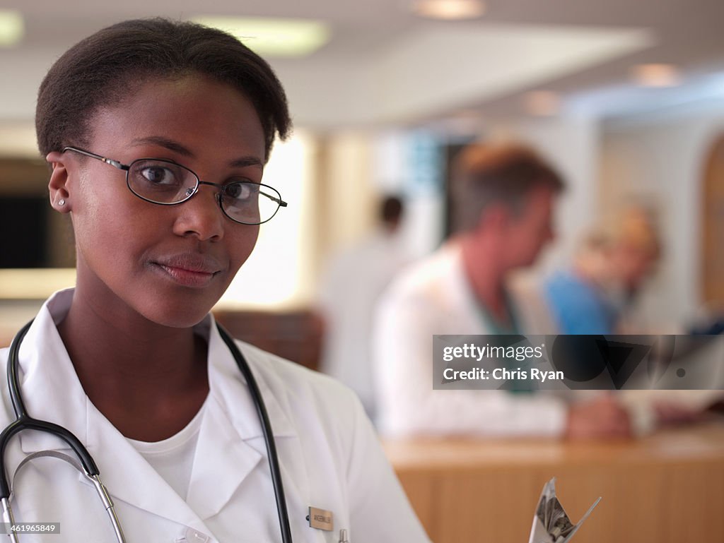 Nurse with clipboard in hospital