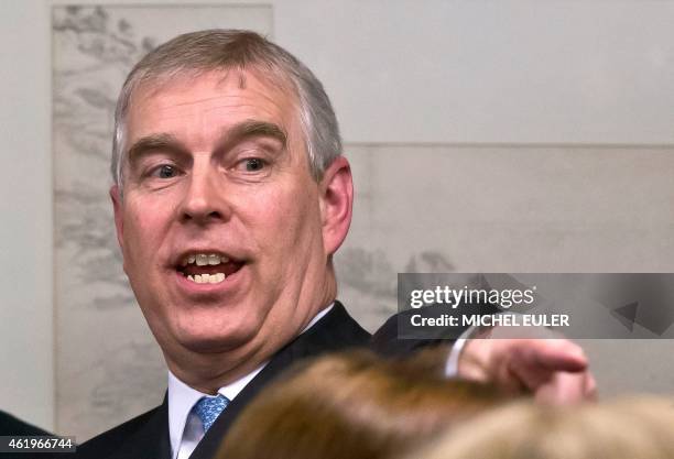 Britain's Prince Andrew gestures during a reception with business leaders on the sidelines of the World Economic Forum in Davos on January 22, 2015....