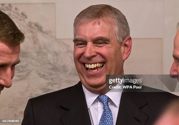 Prince Andrew, Duke of York laughs during a reception with business leaders at the sideline of the World Economic Forum on January 22, 2015 in Davos...