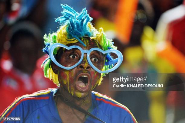 Democratic Republic of the Congo fan cheers for his team during the 2015 African Cup of Nations group B football match between Cape Verde and...