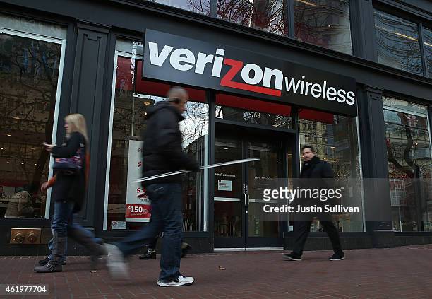 Pedestrians walk by a Verizon Wireless store on January 22, 2015 in San Francisco, California. Verizon reported a drop in fourth quarter earnngs with...