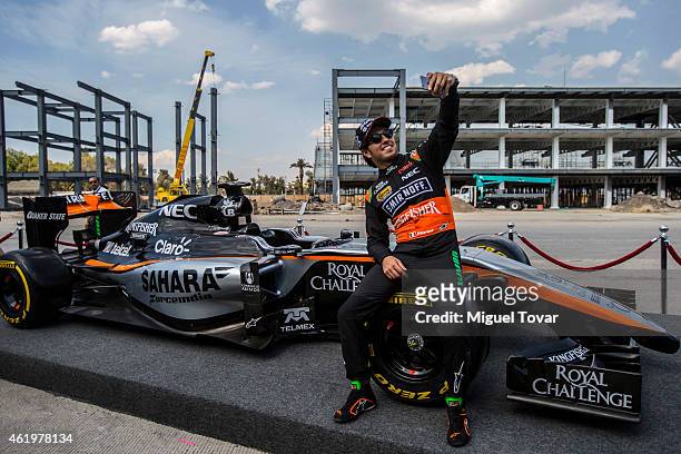 Pilot Sergio Checo Perez poses for pictures during a walk through the Hermanos Rodriguez Racing Circuit Facilities on January 22, 2015 in Mexico...