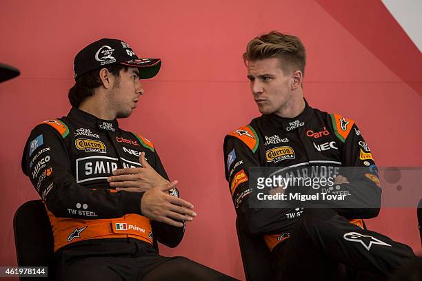 Pilots Sergio Perez and teammate Niko Hulkenberg talks during a press conference at the Hermanos Rodriguez Racing Circuit Facilities on January 22,...