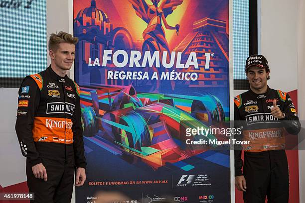 Pilots Sergio Perez and teammate Niko Hulkenberg pose for pictures during a walk through the Hermanos Rodriguez Racing Circuit Facilities on January...