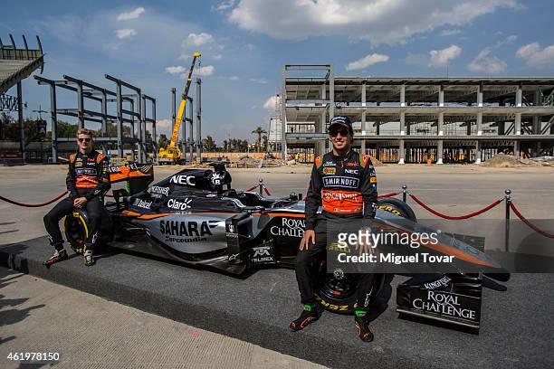 Pilots Sergio Perez and teammate Niko Hulkenberg pose for pictures during a walk through the Hermanos Rodriguez Racing Circuit Facilities on January...
