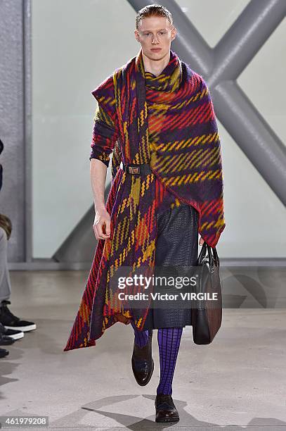 Model walks the runway during the Issey Miyake Men Menswear Fall/Winter 2015-2016 show at Fondation Cartier as part of the Paris Fashion Week on...