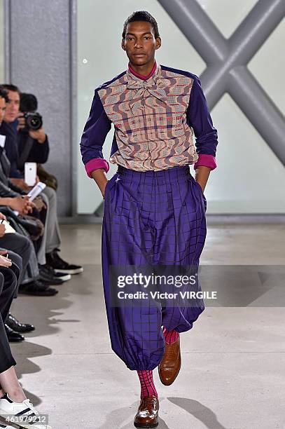 Model walks the runway during the Issey Miyake Men Menswear Fall/Winter 2015-2016 show at Fondation Cartier as part of the Paris Fashion Week on...
