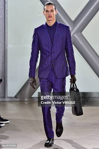 Model walks the runway during the Issey Miyake Men Menswear Fall/Winter 2015-2016 show at Fondation Cartier as part of the Paris Fashion Week on...