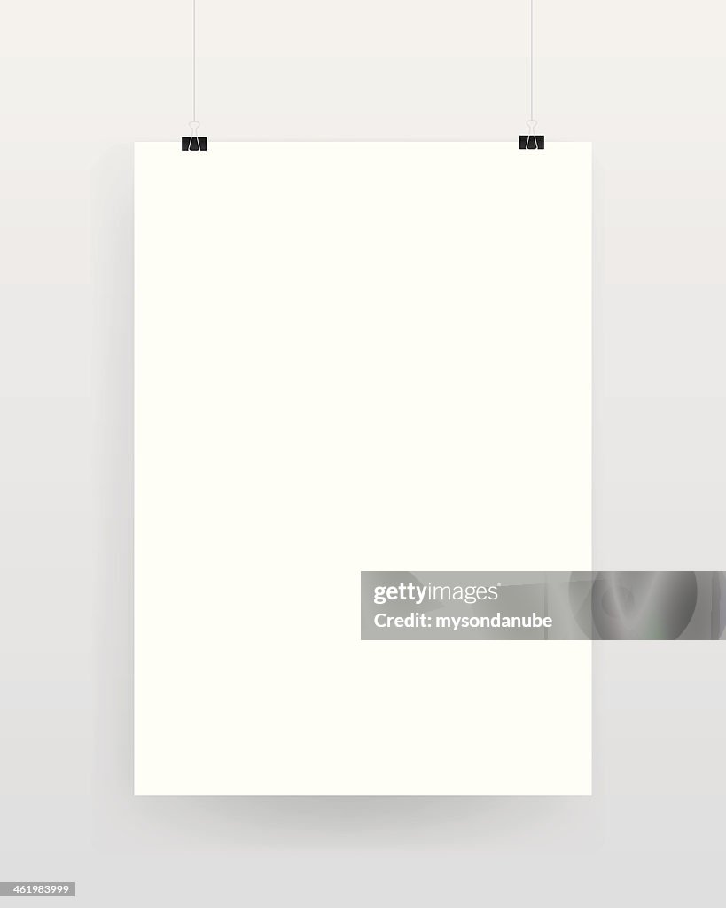 Blank template of a paper sheet on wall
