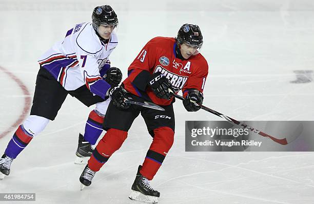 Paul Bittner of Team Orr battles with Dylan Strome of Team Cherry during the 2015 BMO CHL/NHL Top Prospects Game at the Meridian Centre on January...