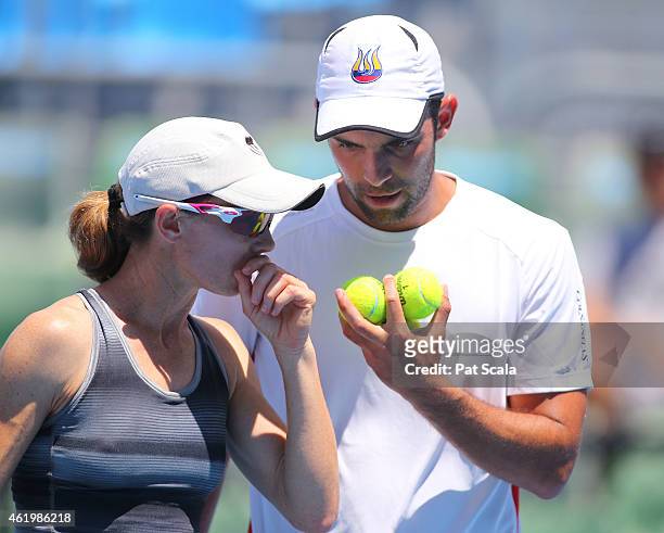 Cara Black of Zimbabwe and Juan Sebastian Cabal of Colombia talk tactics in their first round mixed doubles match against Yung-Jan Chan of Chinese...
