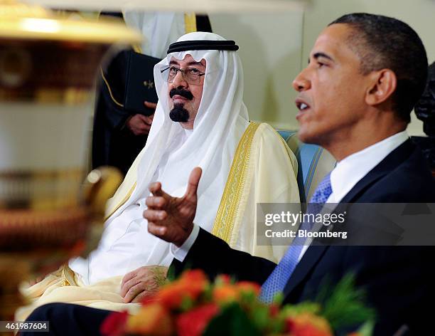 President Barack Obama, right, speaks to the media following a meeting with Saudi Arabia's King Abdullah bin Abdulaziz Al Saud, left, in the Oval...