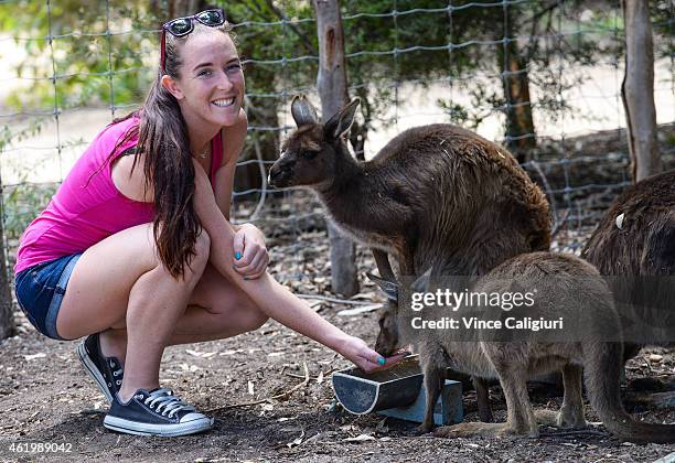 Madison Brengle of USA feeding Kangaroos and the Melbourne Zoo during the 2015 Australian Open at Melbourne Park on January 23, 2015 in Melbourne,...