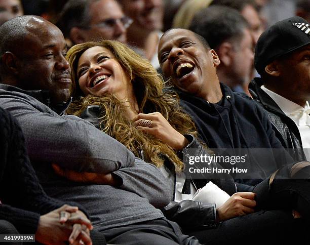 Beyonce and Jay Z laugh during the game between the Brooklyn Nets and the Los Angeles Clippers at Staples Center on January 22, 2015 in Los Angeles,...