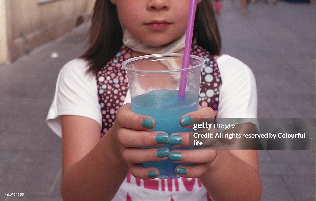 Girl with blue drink