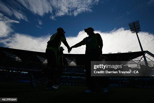 Australian players walk from the field after the first innings during the One Day International Tri Series match between Australia and England at...