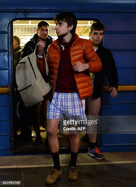 People in underwear wait for a train in the Kiev subway as they take part in the 2014 No Pants Subway Ride on January 12, 2014. Started by Improv...