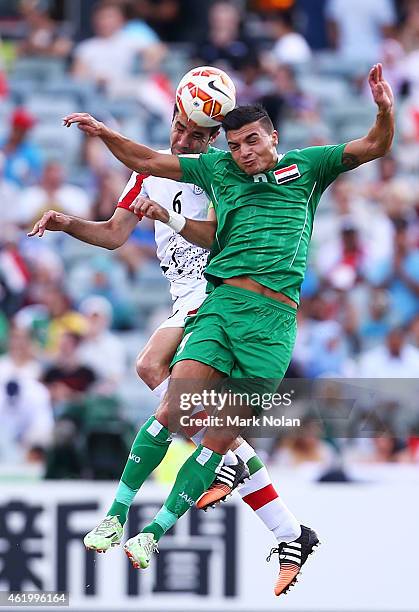 Javad Nekonam of Iran and Ahmed Yaseen Gheni of Iraq contest possession during the 2015 Asian Cup match between Iran and Iraq at Canberra Stadium on...