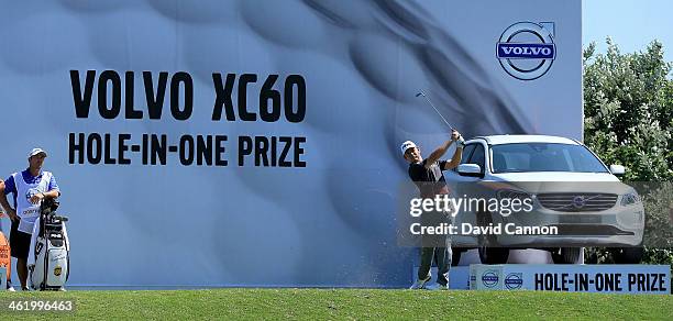 Louis Oosthuizen of South Africa plays his tee shot on the 12th hole during the final round of the 2014 Volvo Golf Champions at Durban Country Club...