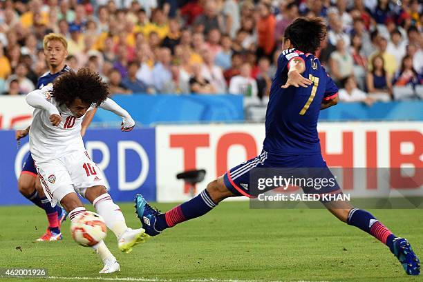 Japan's Yasuhito Endo fights for the ball with Omar Abdulrahman of United Arab Emirates during the quarter-final football match between Japan and UAE...