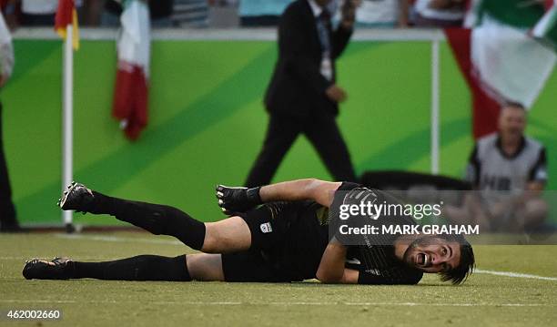 Goalkeeper Alireza Haghighi of Iran reacts to being brought down during the Asian Cup quarter-final football match between Iraq and Iran in Canberra...