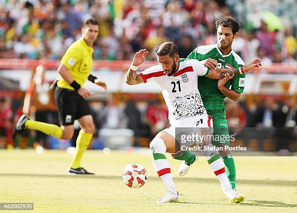 Saad Abdulameer of Iraq and Ashkan Dejagah of Iran contest possession during the 2015 Asian Cup match between Iran and Iraq at Canberra Stadium on...