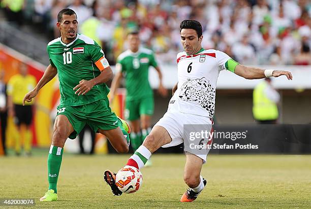 Javad Nekonam of Iran and Younus Mahmood of Iraq contest possession during the 2015 Asian Cup match between Iran and Iraq at Canberra Stadium on...