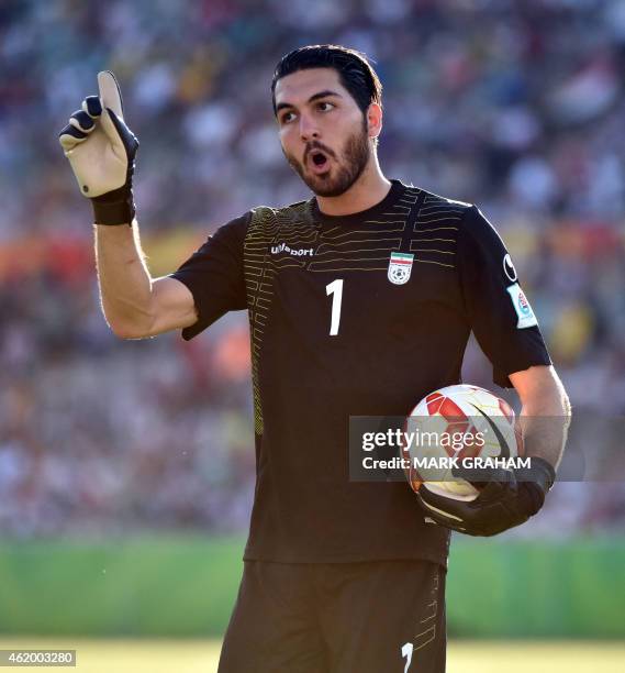 Iranian goal keeper Alireza Haghighi gestures during the Asian Cup quarter-final football match between Iraq and Iran in Canberra on January 23,...