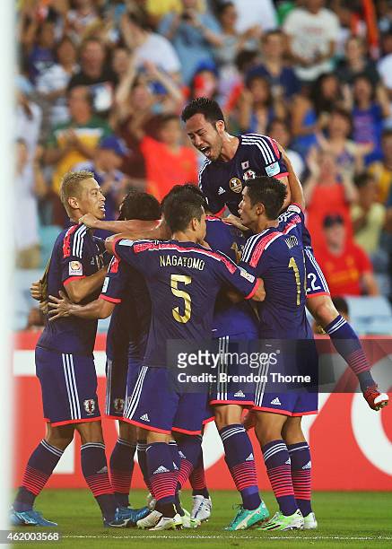 Gaku Shibasaki of Japan celebrates with team mates after scoring a goal during the 2015 Asian Cup Quarter Final match between Japan and the United...