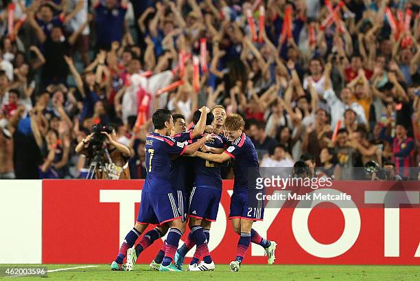 Gaku Shibasaki of Japan celebrates scoring a goal with team mates during the 2015 Asian Cup Quarter Final match between Japan and the United Arab...