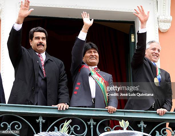 Nicolas Maduro, President of Venezuela, Evo Morales, President of Bolivia, and Álvaro García Linera, Vice-President of Bolivia greet the people from...