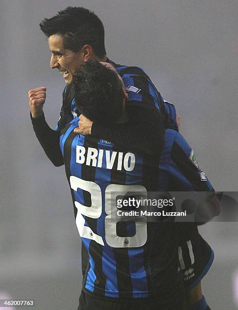 Maximiliano Moralez of Atalanta BC celebrates his goal with his team-mate Davide Brivio during the Serie A match between Atalanta BC and Calcio...