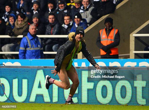 Fan wearing a 'Mankini' runs onto the pitch during the Barclays Premier League match between Newcastle United and Manchester City at St James' Park...