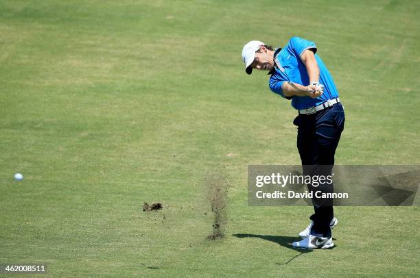 Tommy Fleetwood of England plays his second shot on the par 4, first hole during the final round of the 2014 Volvo Golf Champions at Durban Country...