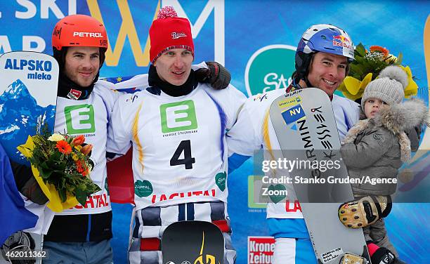 Zan Kosir of Slovenia takes 2nd place, Andrey Sobolev of Russia takes 1st place, Benjamin Karl of Austria takes 3rd place during the FIS Snowboard...