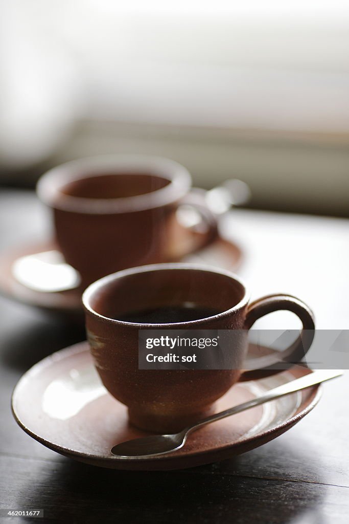 Coffee cup on the table at morning